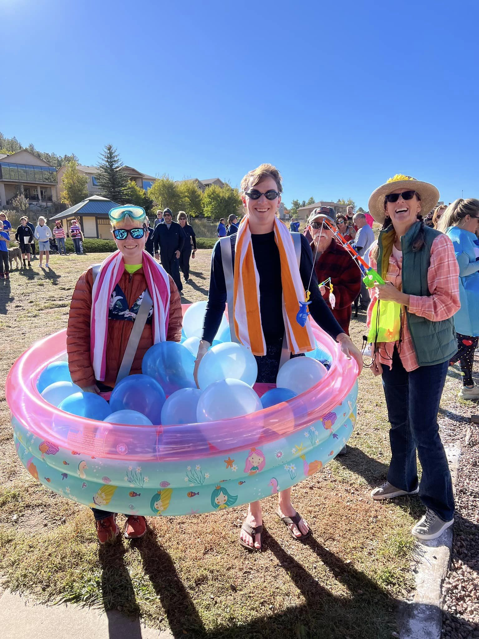 Runners dressed as a fishbowl at the .5K