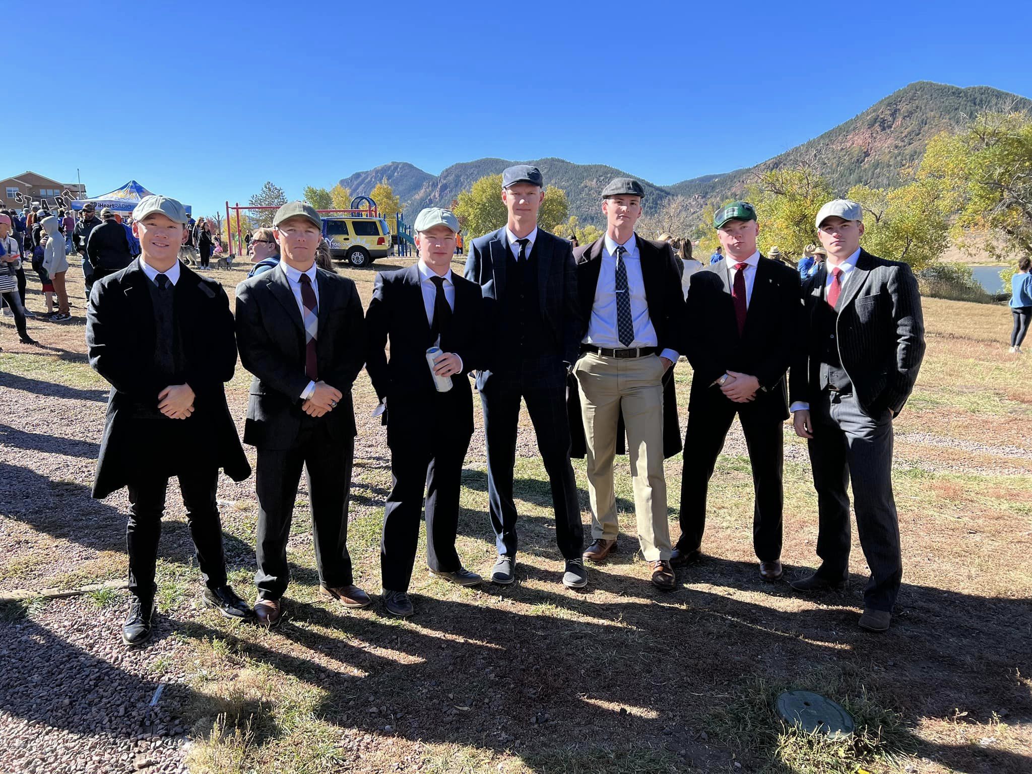 A group of runners dressed in matching suits at the .5K