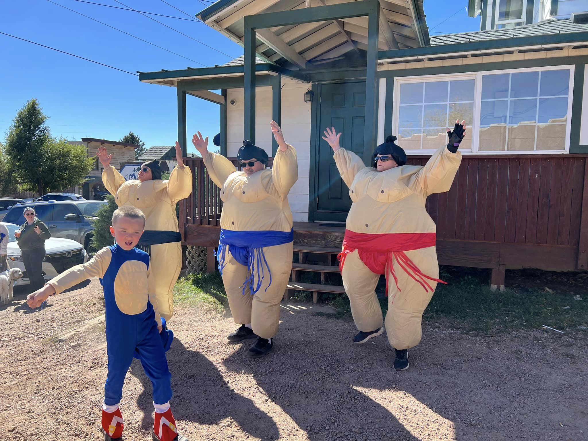 Runners in inflatable sumo costumes at the .5K