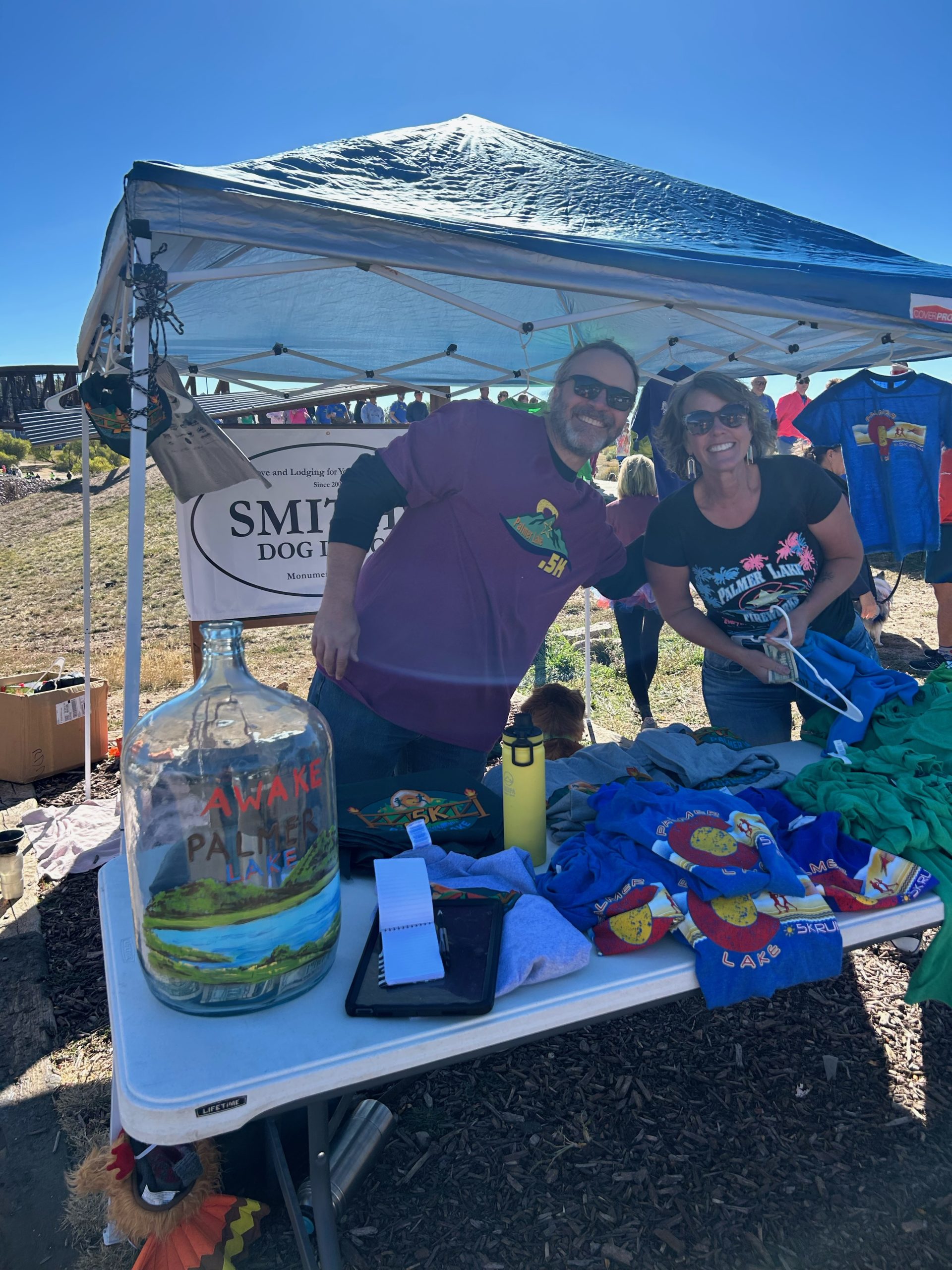 Volunteers at the .5K merchandise table